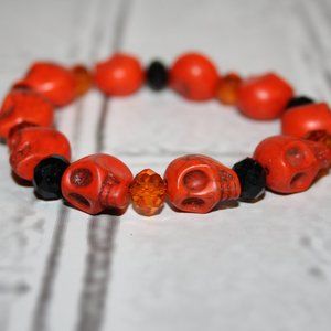 Beautiful orange and black beaded Skull bracelet 7"